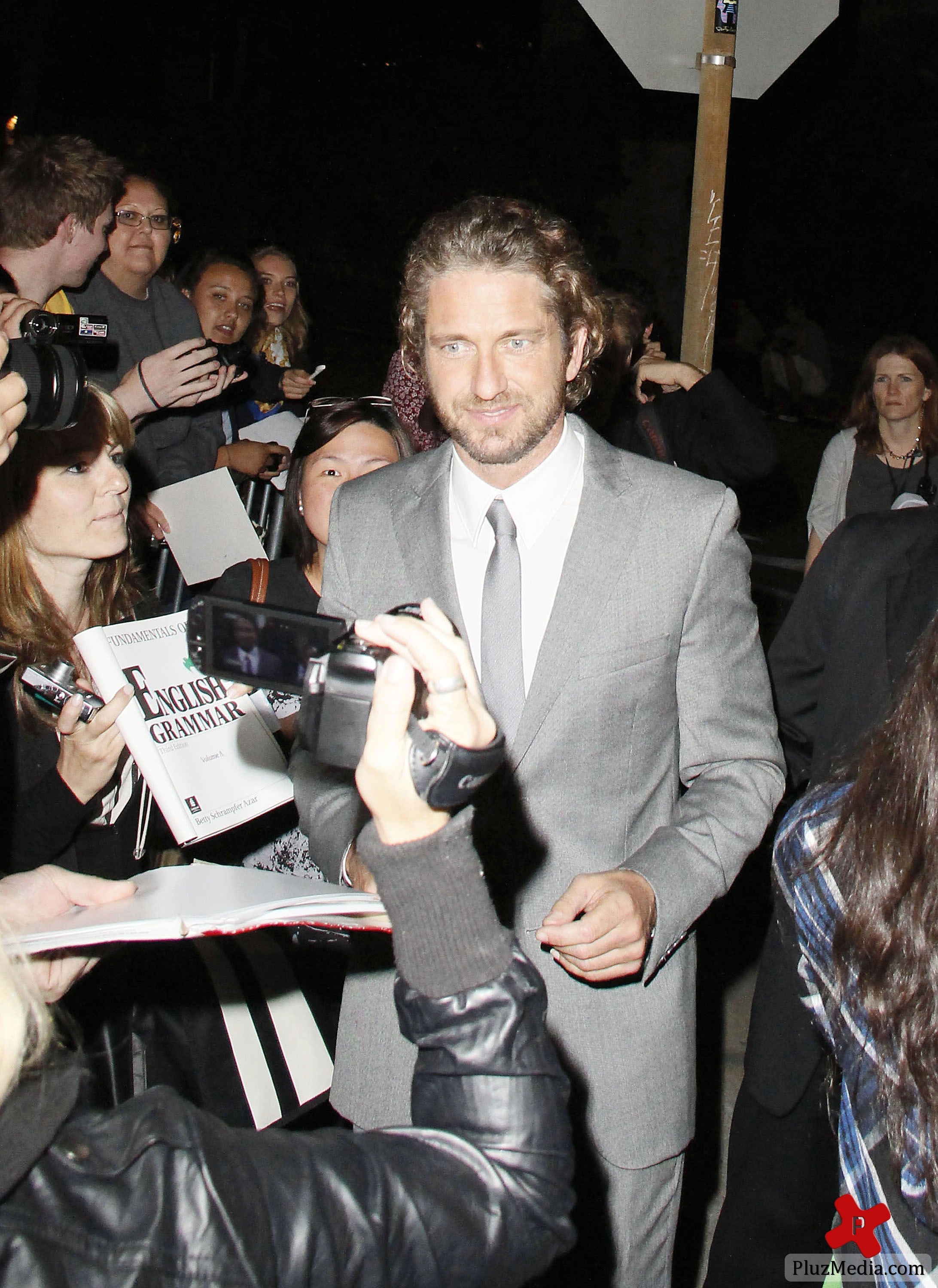 Gerard Butler signs autographs for fans at the 'Machine Gun Preacher' premiere | Picture 84225